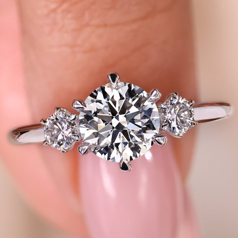 Elegant 3 stone diamond ring showcasing timeless beauty and sparkle.
