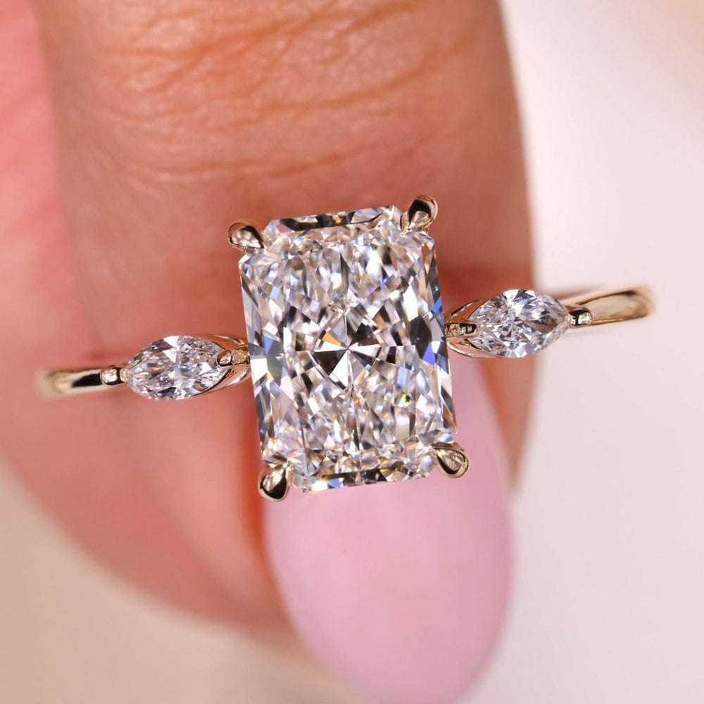 Elegant Three Stone Engagement Ring with radiant brilliance and charm.
