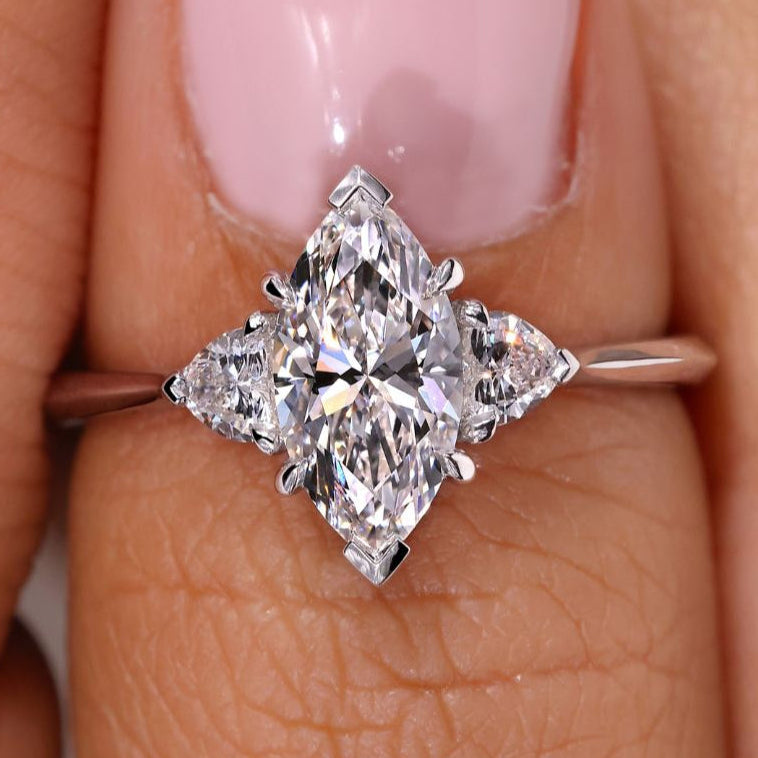 Stunning 3 stone marquise engagement ring crafted with exceptional brilliance and elegance.

