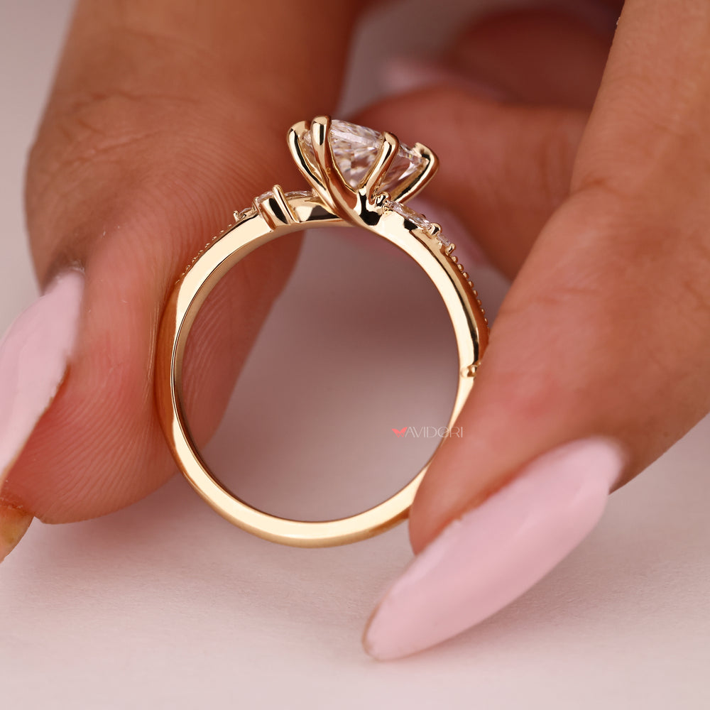 Pear diamond engagement ring with six claw prong setting
