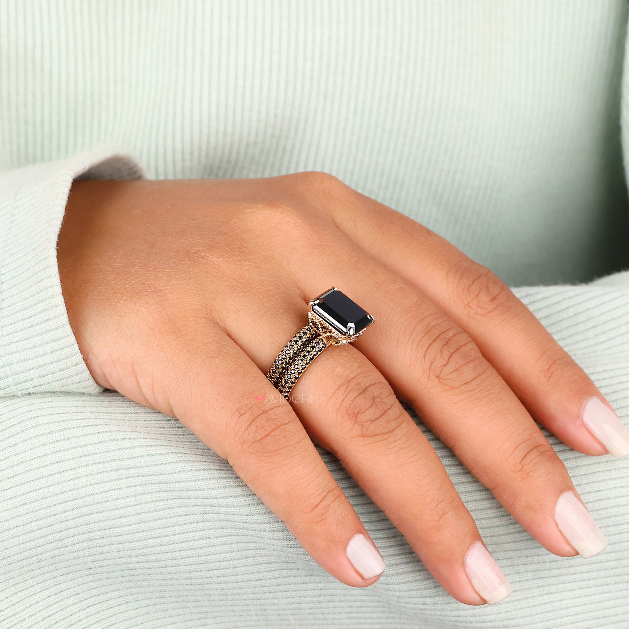 Yellow gold ring with an emerald cut moissanite center for a classic look.
