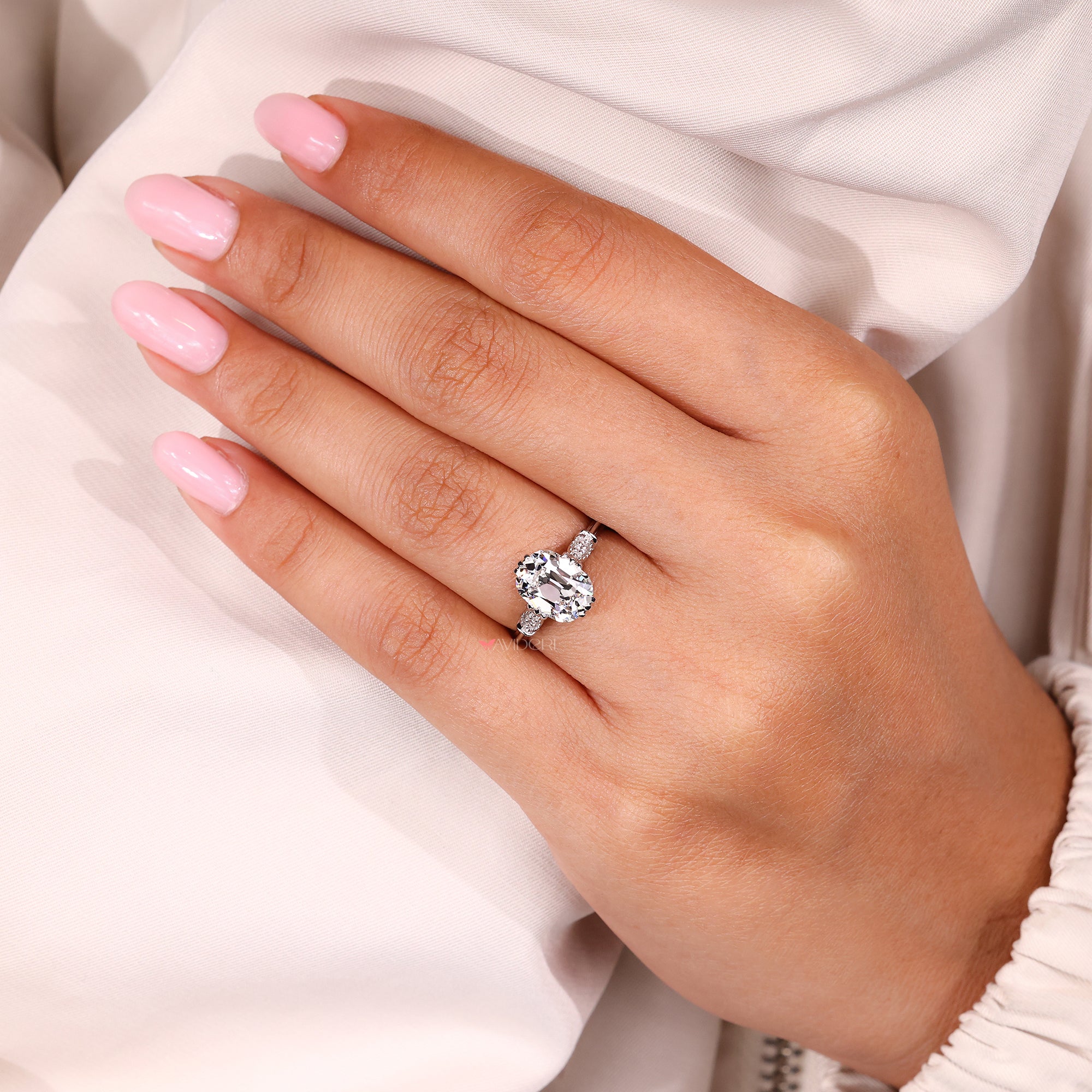 Avideri engagement ring with cushion Old European Cut diamond and custom cathedral setting.
