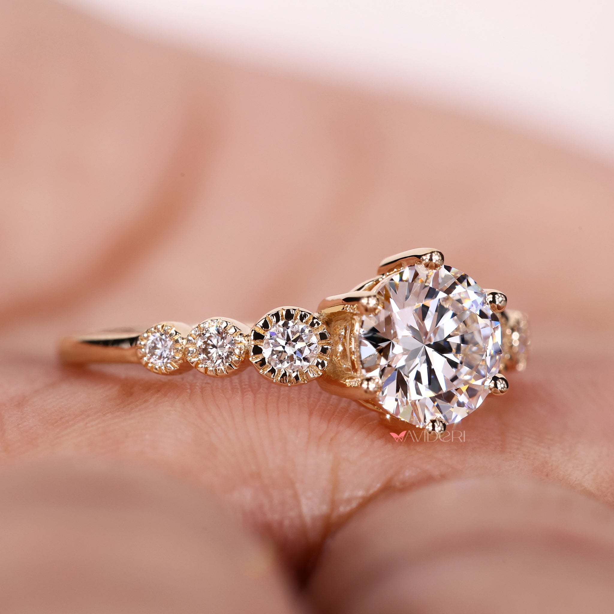 Avideri engagement ring with a tapered pave engagement ring style featuring a gold tapered pave engagement ring setting.
