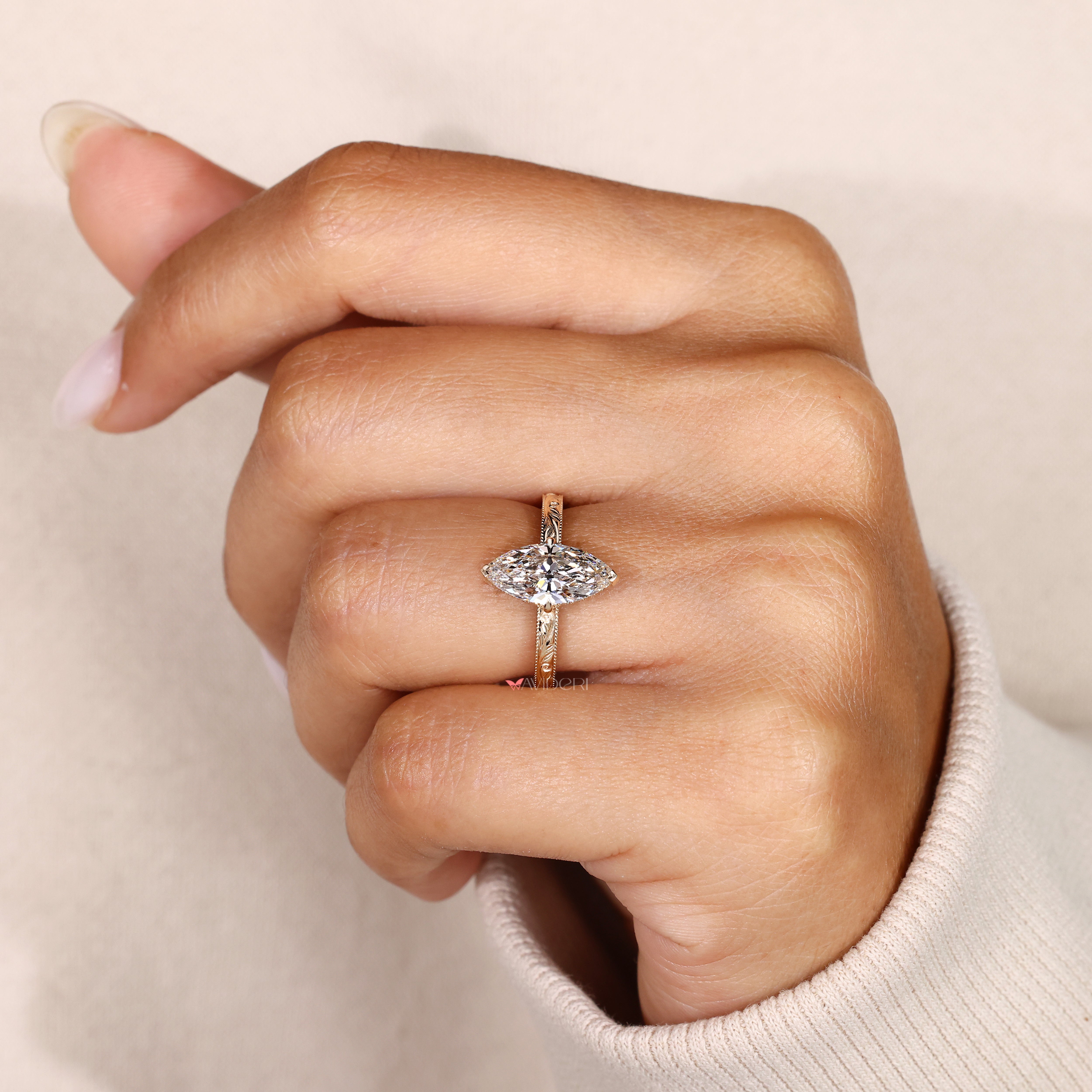 Filigree marquise ring with hidden halo diamonds.
