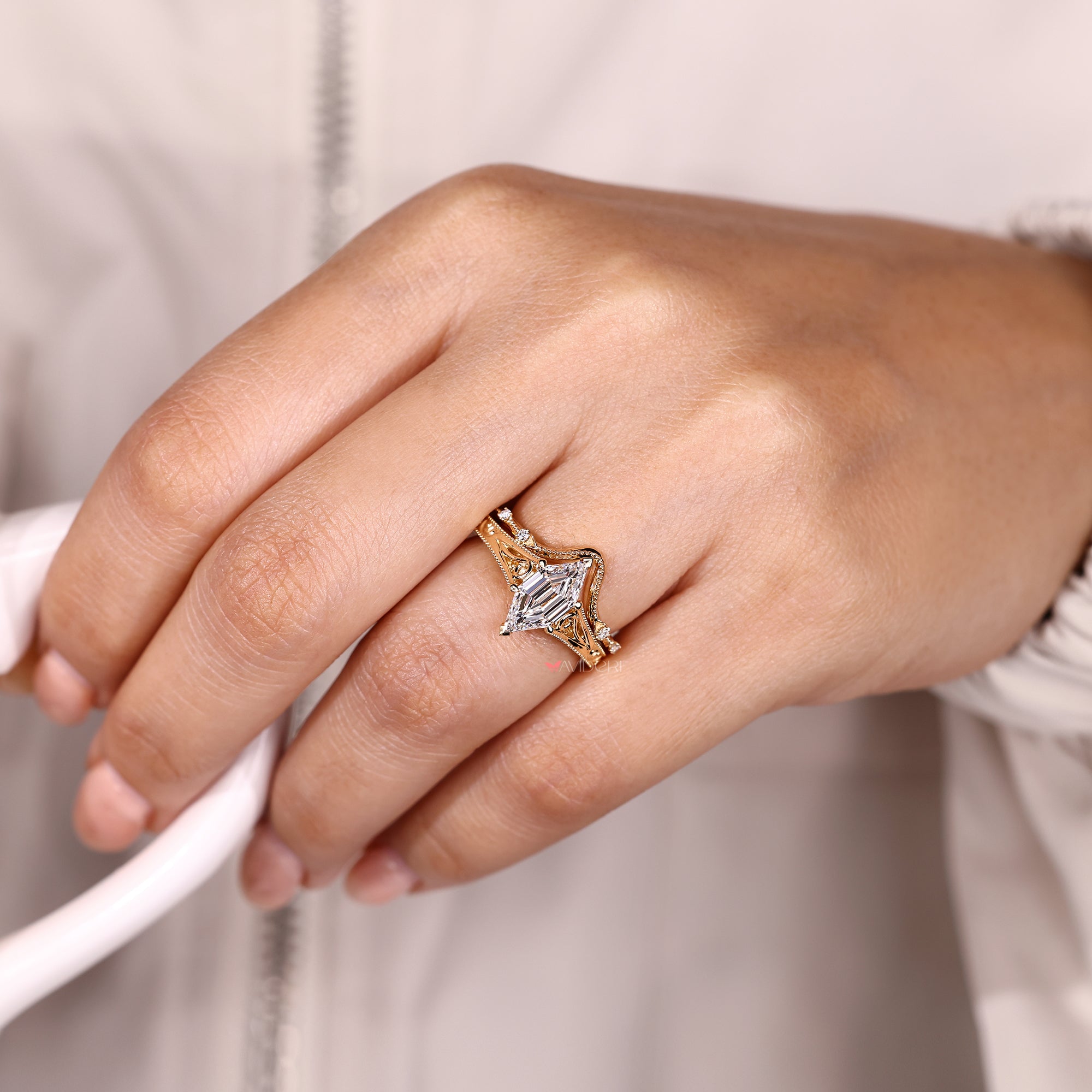 Hexagon diamond ring with matching round band.
