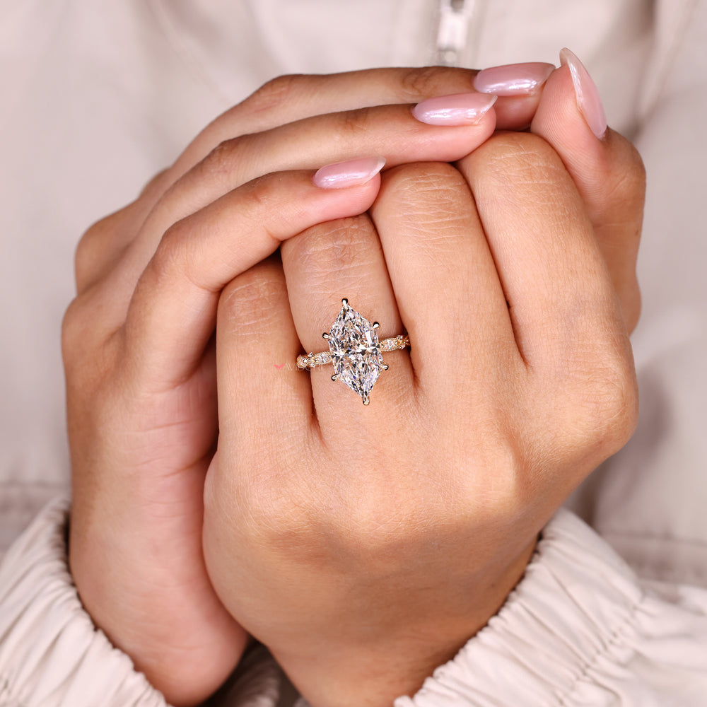 Marquise ring with round side stones vintage style.
