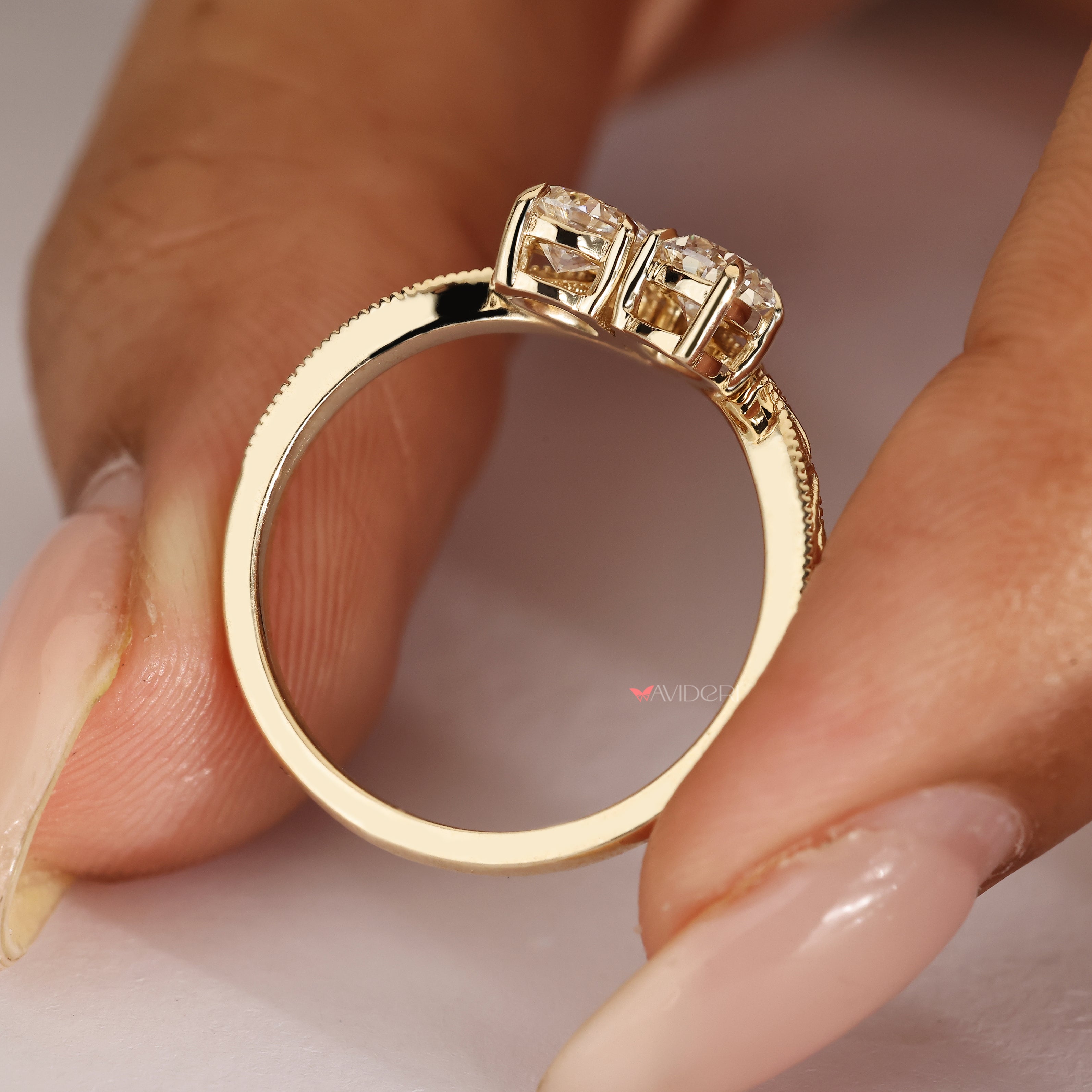Vintage pear and round diamond toi et moi ring.
