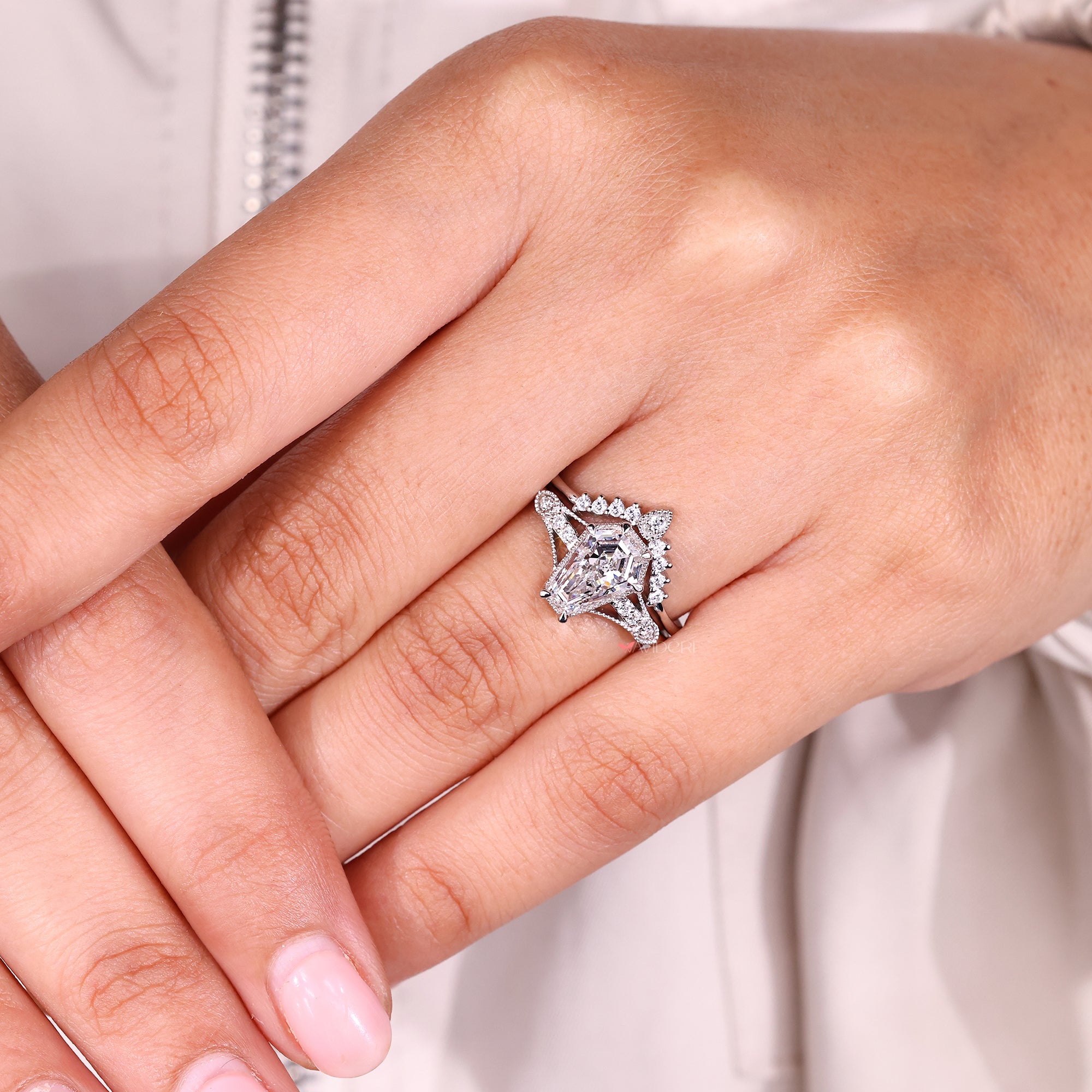 Curved wedding band paired with an engagement ring.