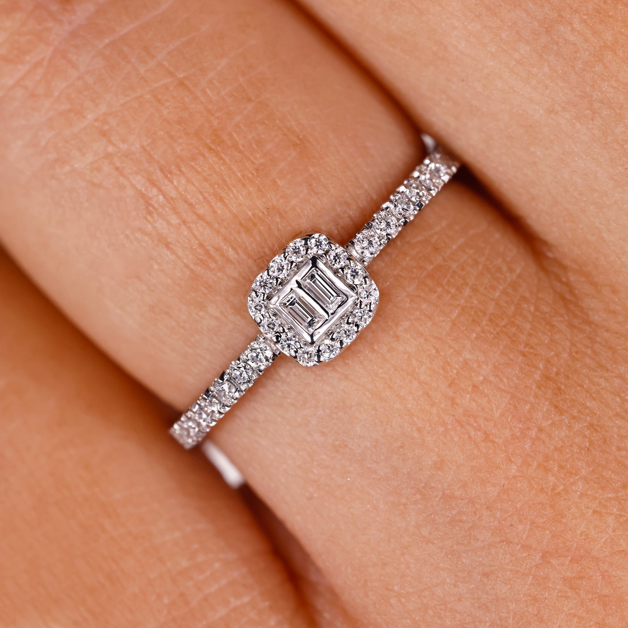 baguette and round diamond engagement ring in white gold with prong setting.