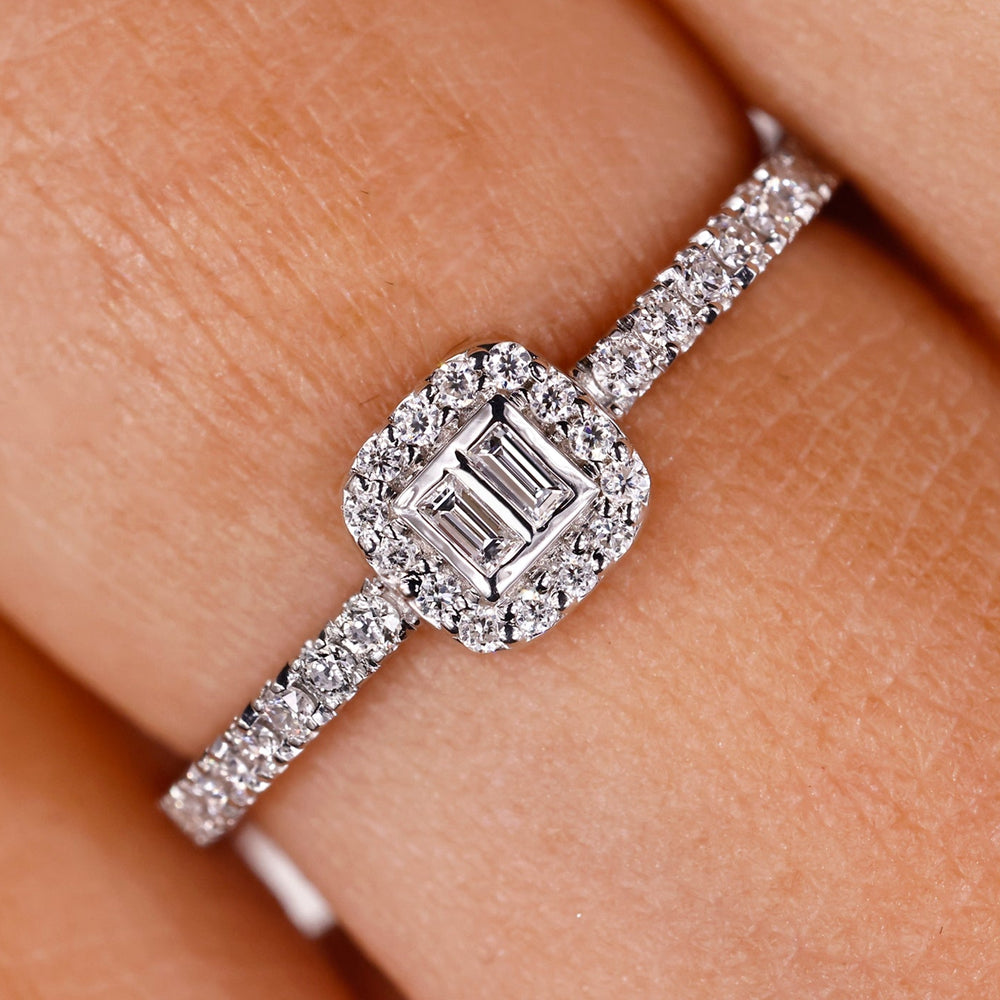 baguette and round diamond engagement ring in white gold with prong setting.