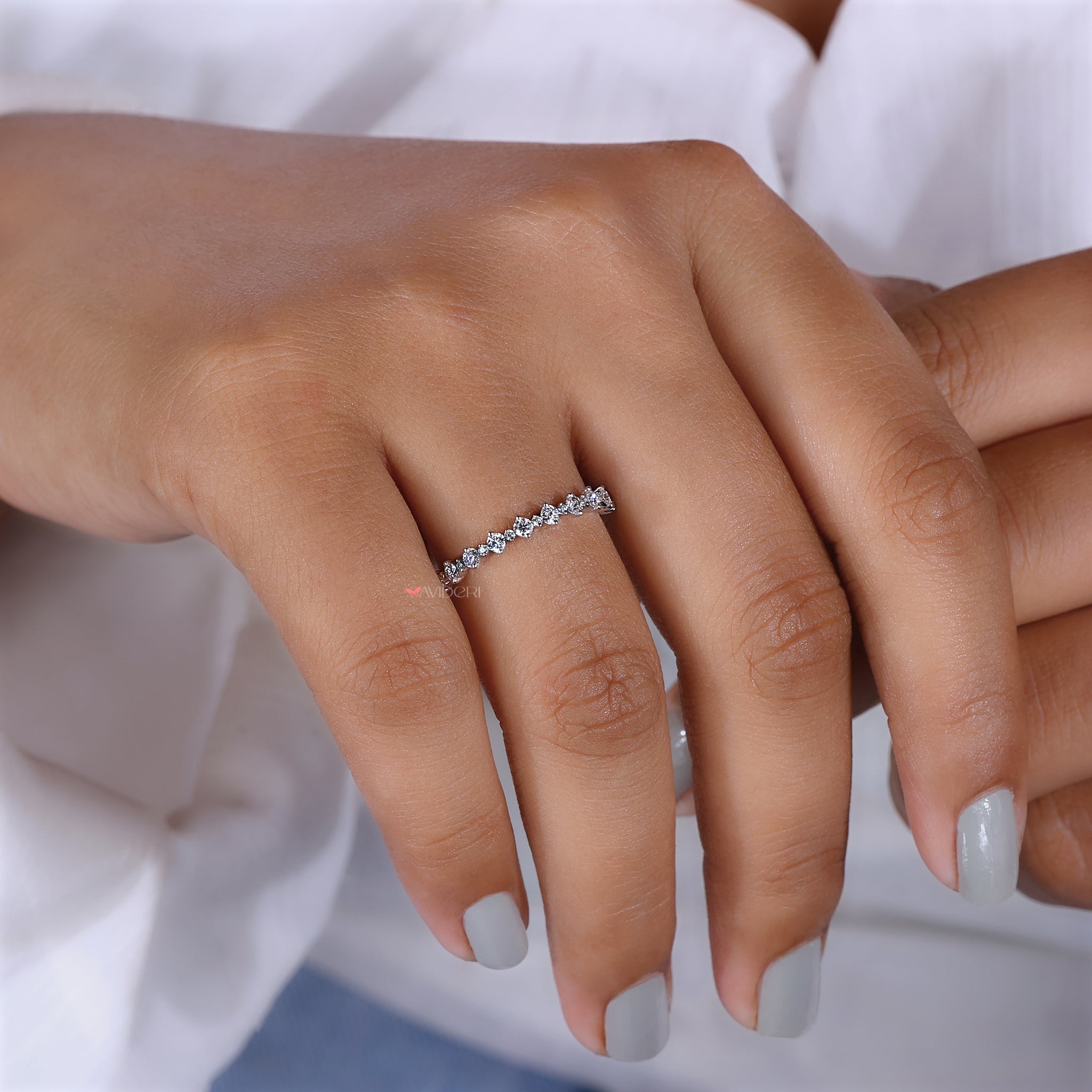 Sparkling round cut moissanite band ring.
