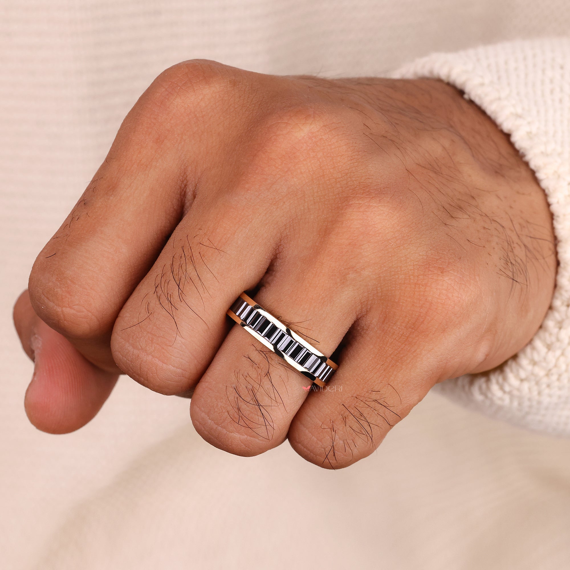 Black baguette cut band on yellow gold wedding band.
