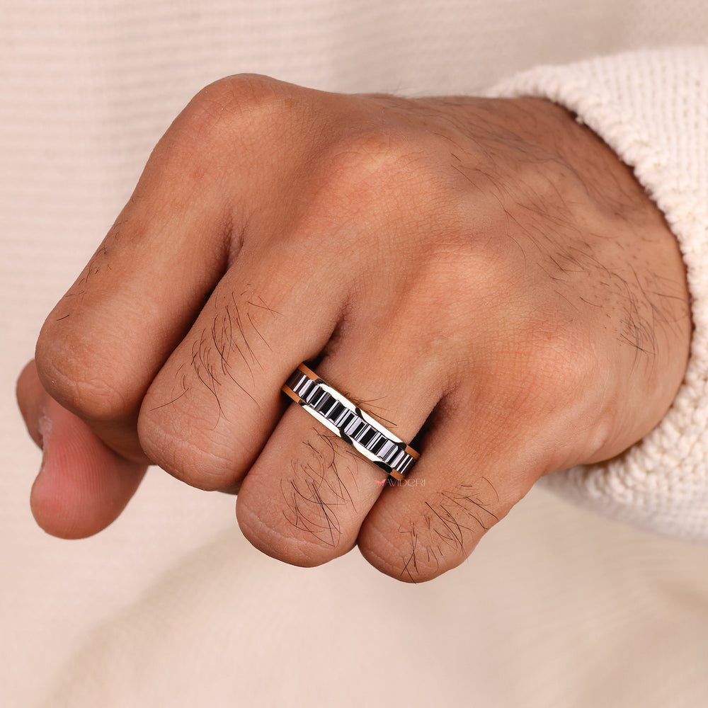 Black baguette cut band on yellow gold wedding band.