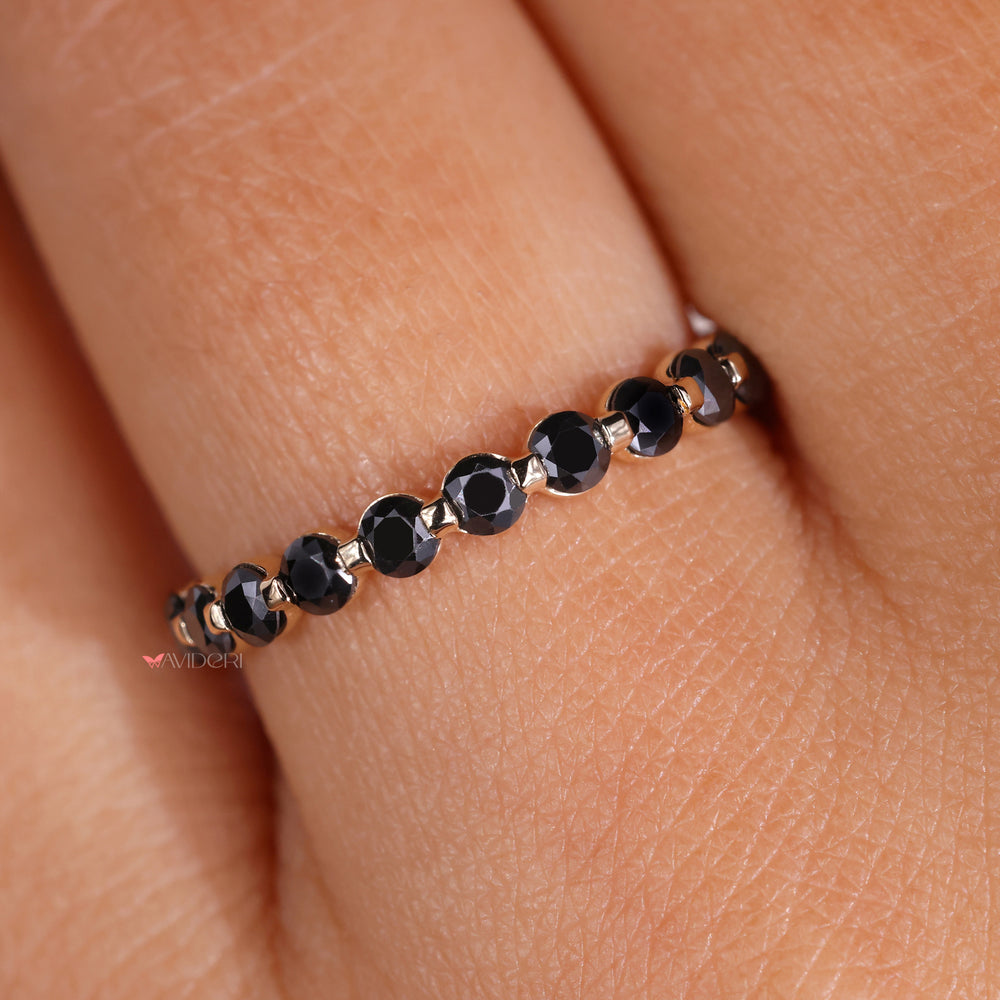 The white gold wedding band complements any gemstone with elegance.