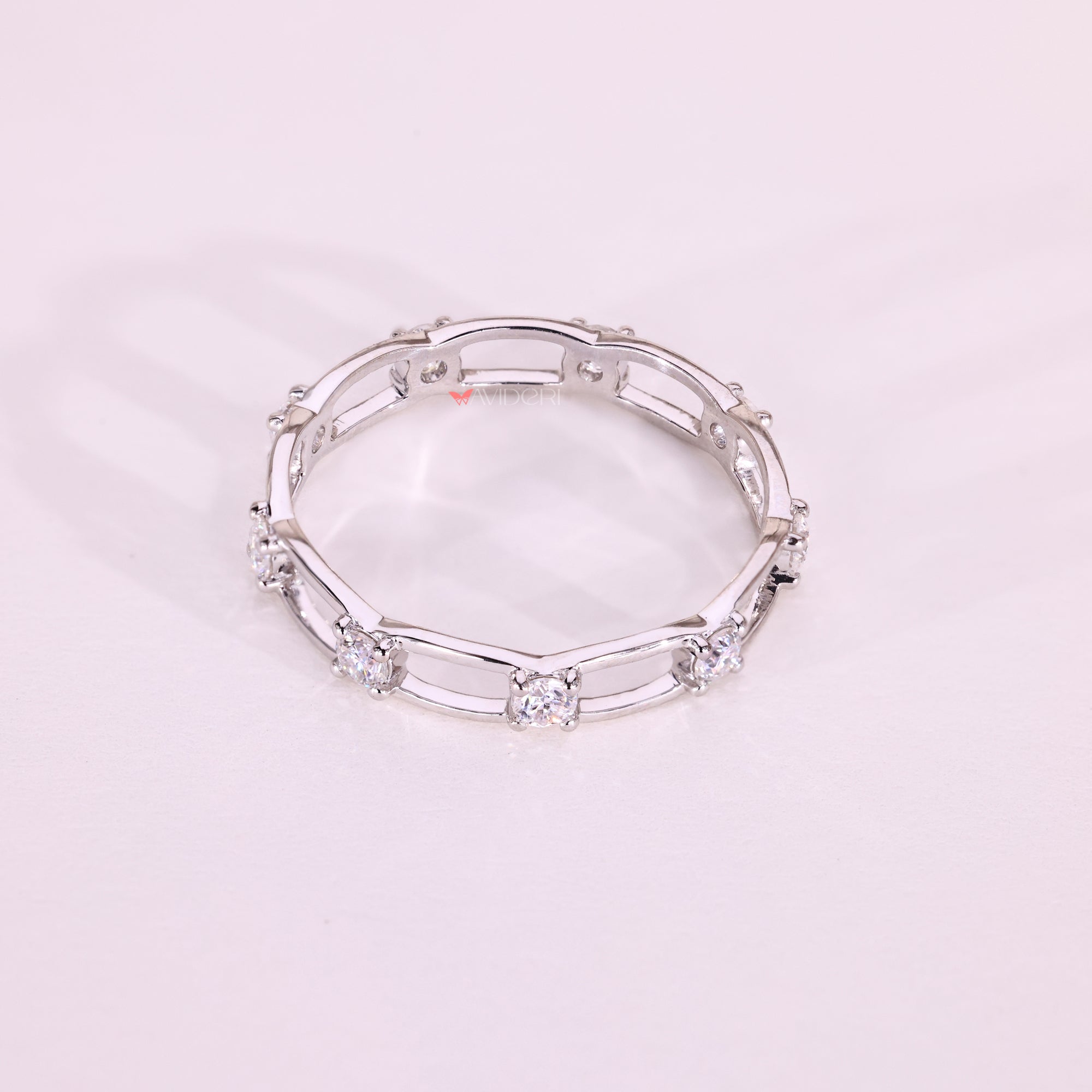Elegant round moissanite eternity wedding ring.
