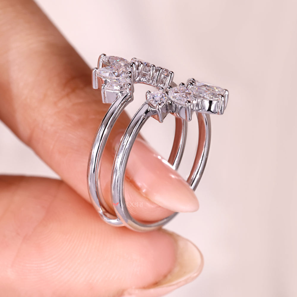 Marquise and pear cut moissanite curved enhancer band.
