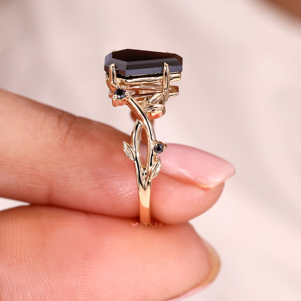 Round side stone ring paired with a striking black moissanite.