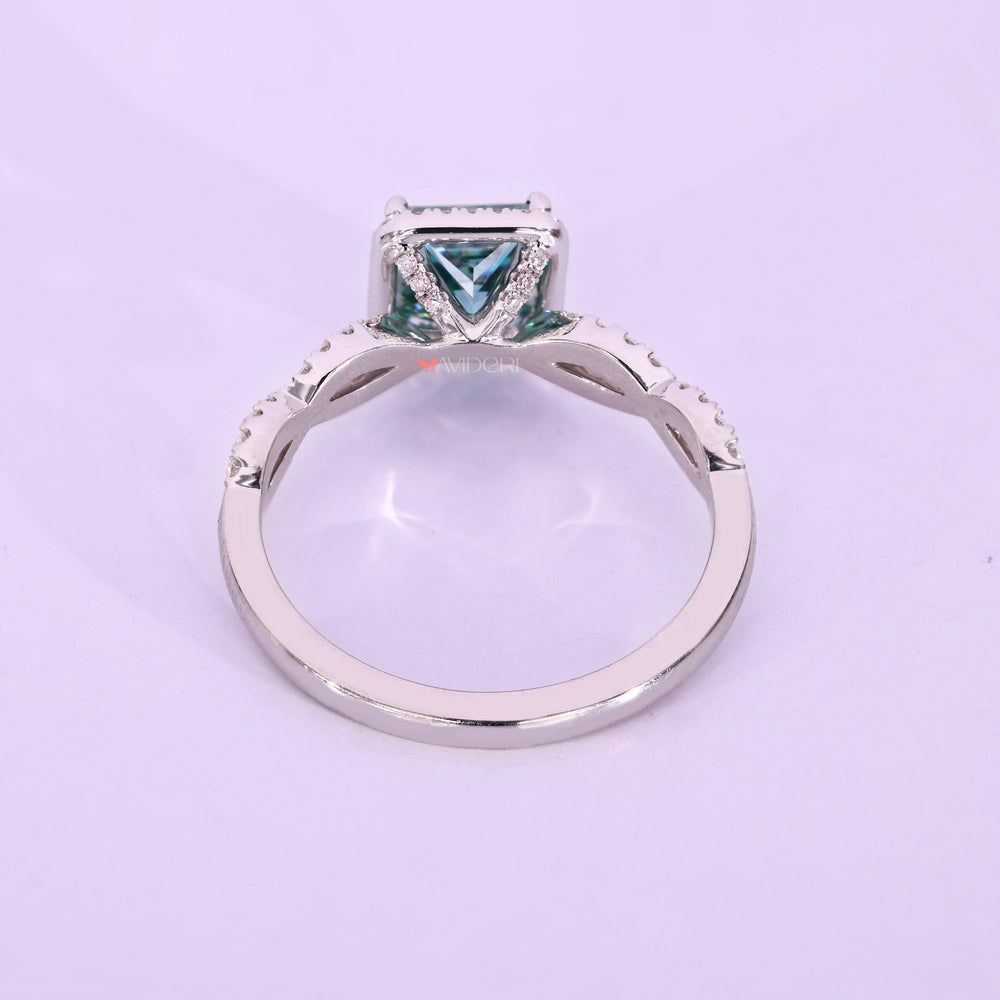 White gold halo set ring with brilliant stones surrounding the center.