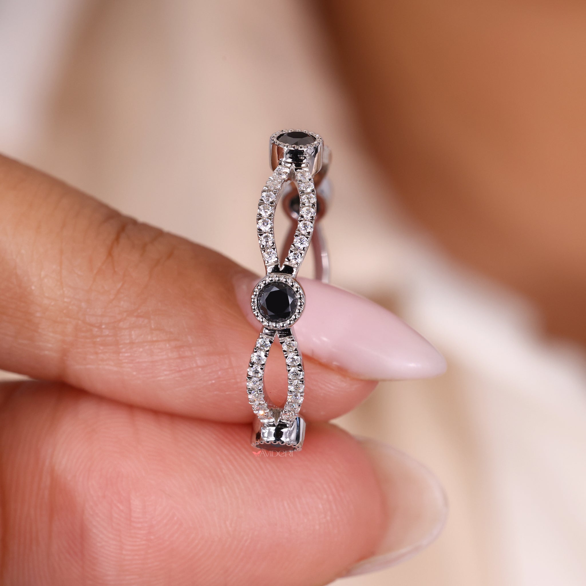 White gold wedding band with infinity wedding band details.