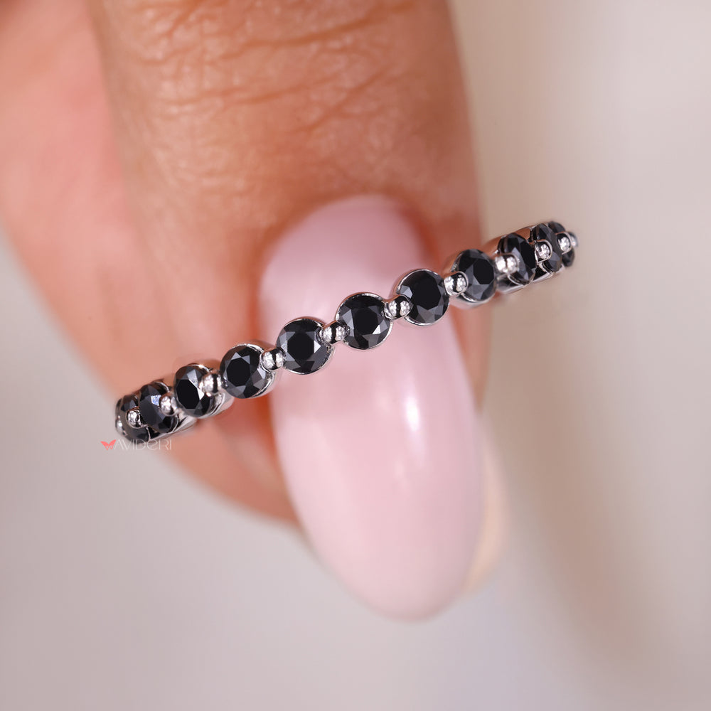 Moissanite eternity band set in a white gold wedding band for elegance.