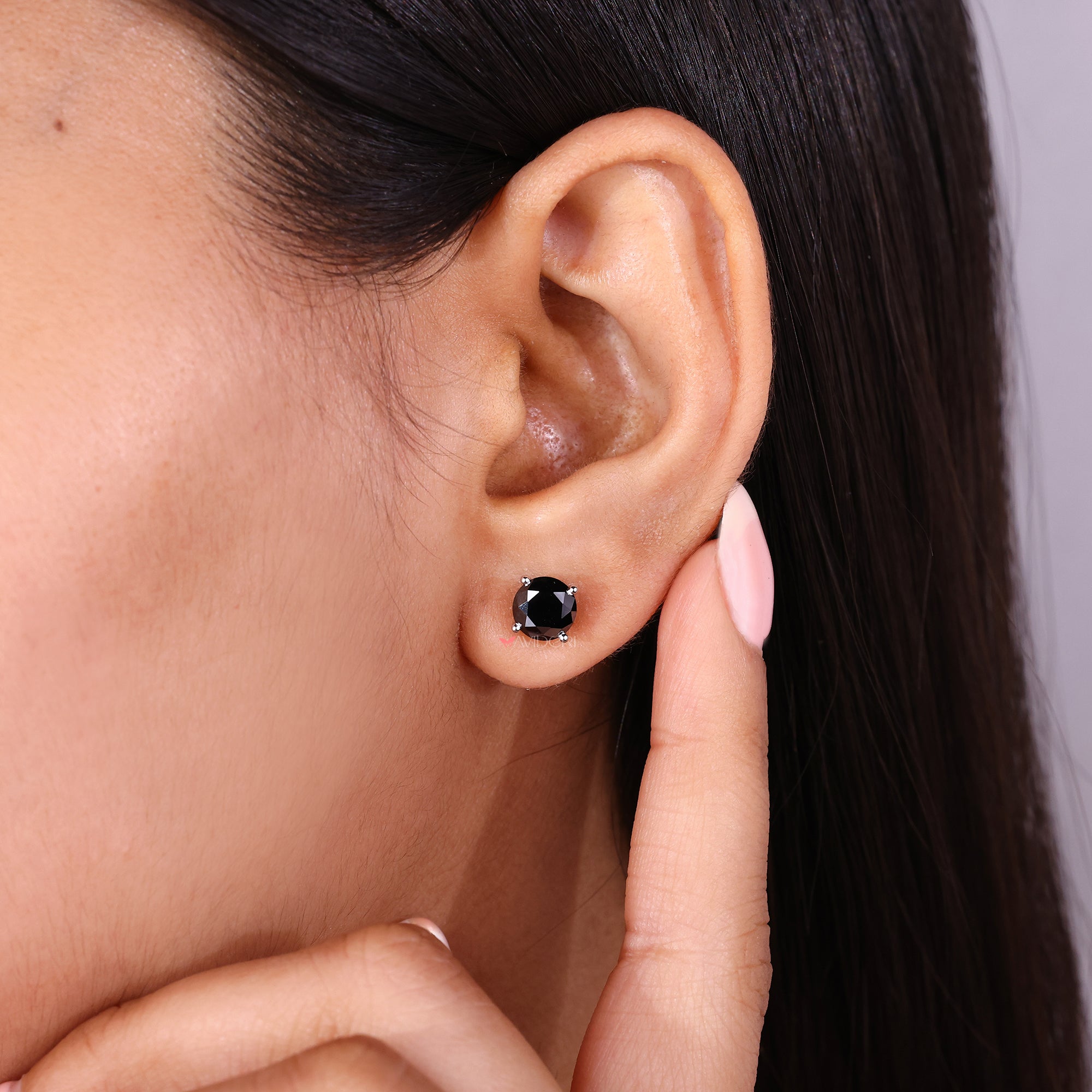 Moissanite stud earrings with a 4 prong setting in white gold.