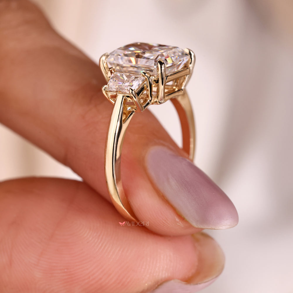 Radiant moissanite ring with trapezoid side accents.
