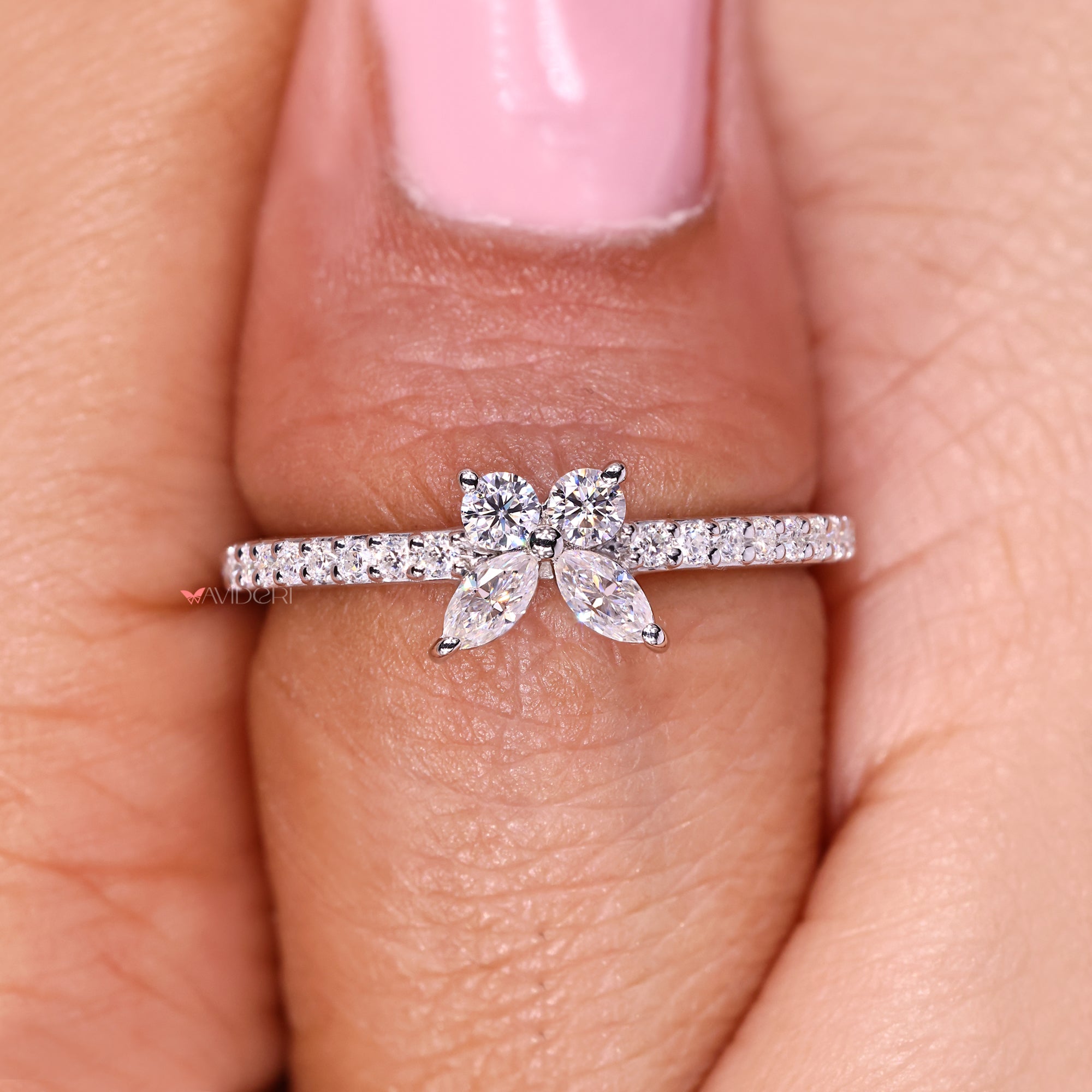 Pave ring with a delicate marquise cut center stone
