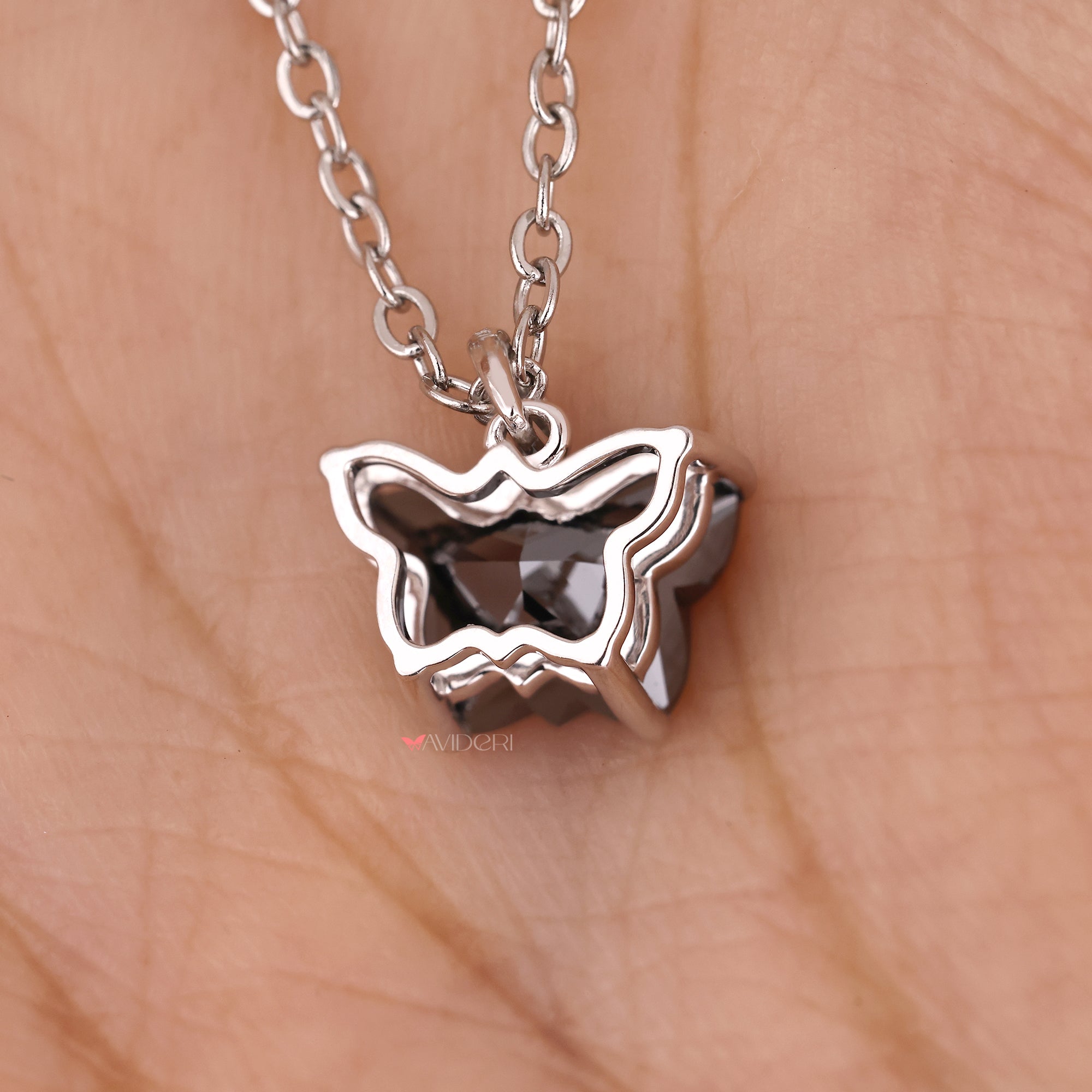 Custom moissanite pendant in butterfly design set in gold for elegance.
