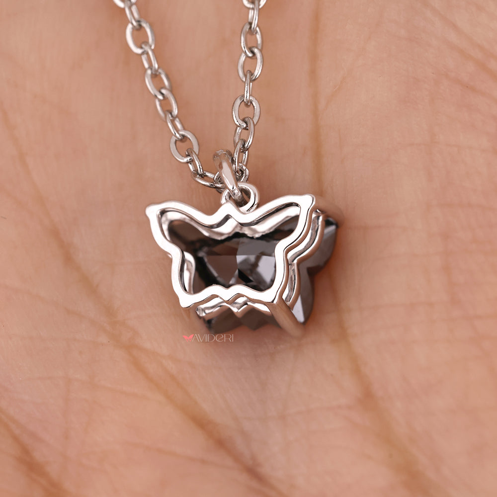 Custom moissanite pendant in butterfly design set in gold for elegance.
