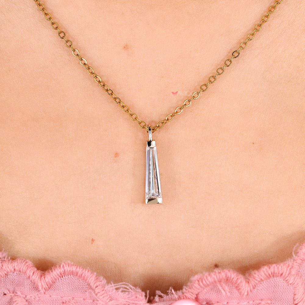 Handmade moissanite solitaire pendant with baguette side stones.
