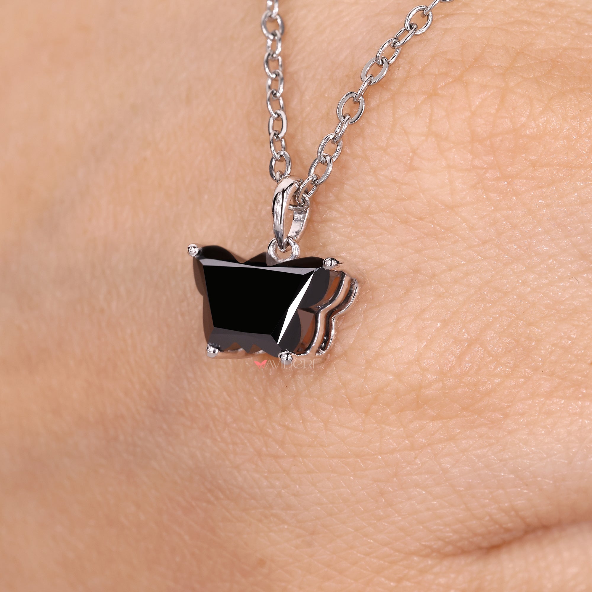 White gold pendant featuring a butterfly pendant for added charm.
