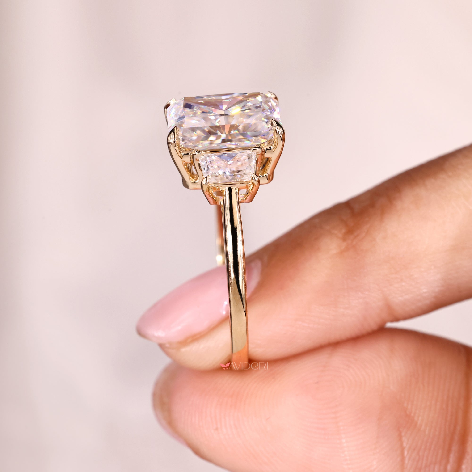 Buy engagement ring with radiant and trapezoid moissanite stones.