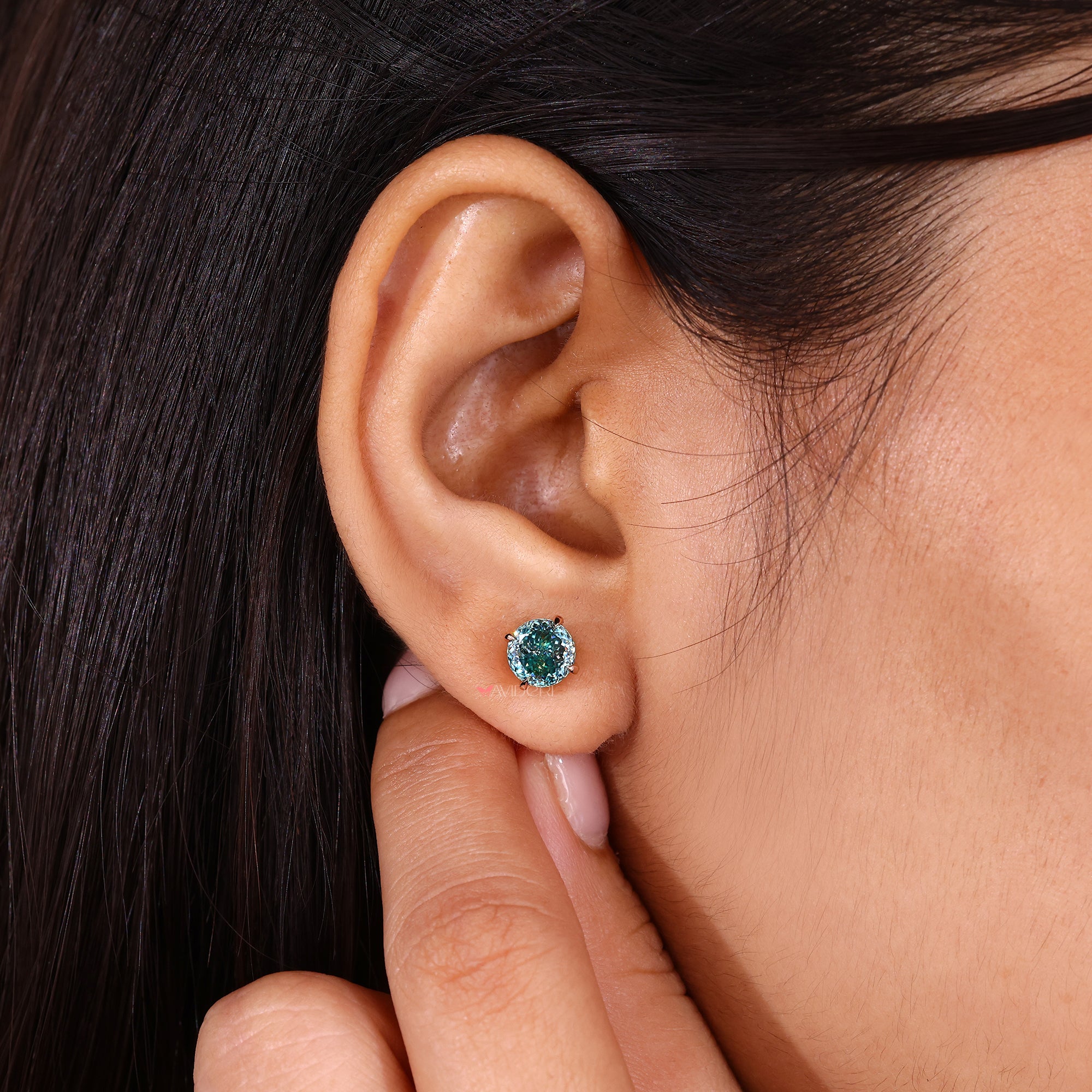 Cyan blue earrings with rose gold earrings finish.