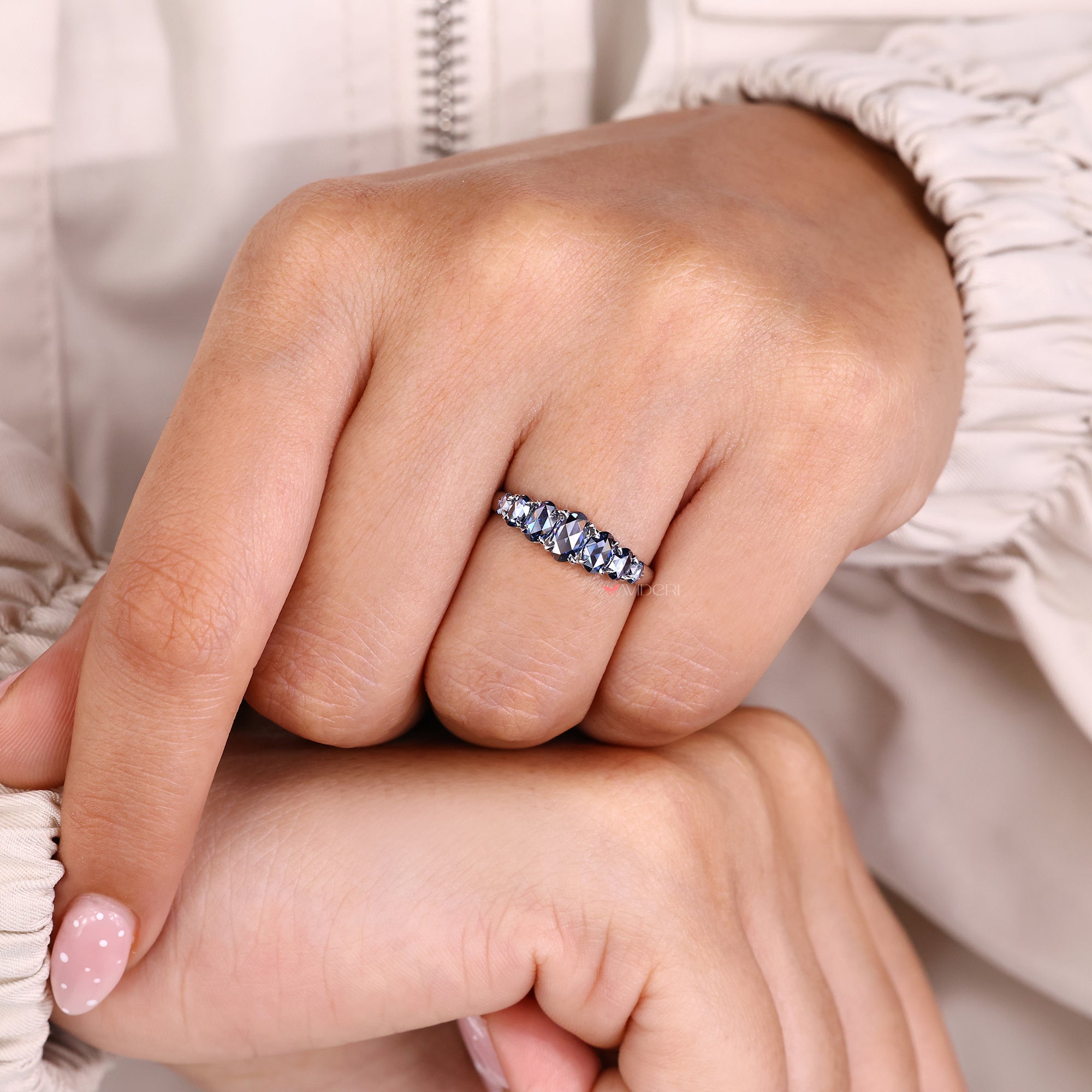 Moissanite wedding band on white gold wedding band.