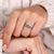 Moissanite wedding band on white gold wedding band.