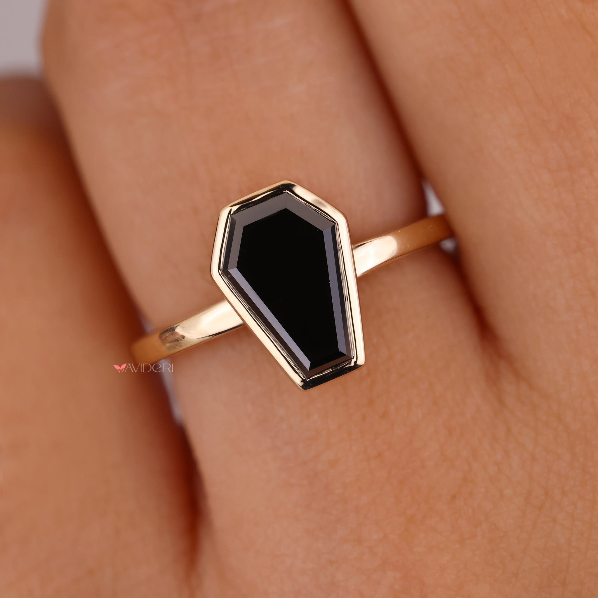 Bold, unique angles stand out in the coffin cut ring.
