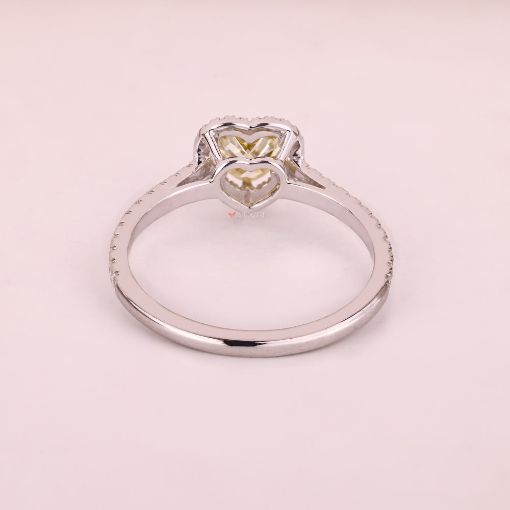 Handmade heart cut moissanite ring with halo design.