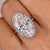 Moval cut engagement ring, halo engagement ring, twisted ring.