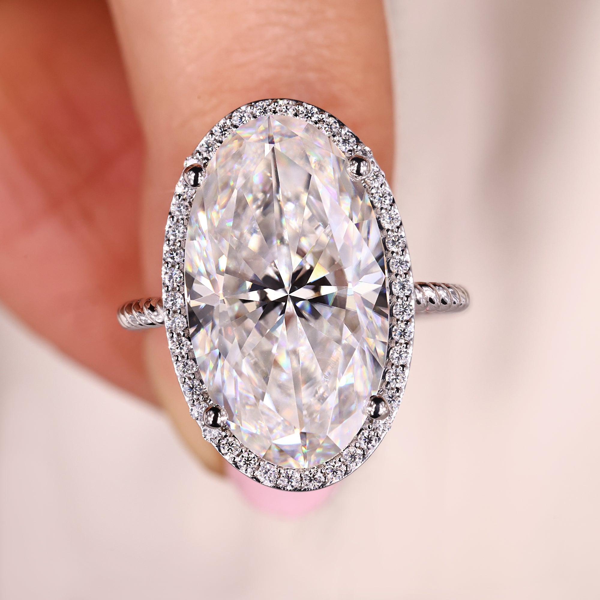 Moval cut engagement ring, round cut engagement ring, halo ring.