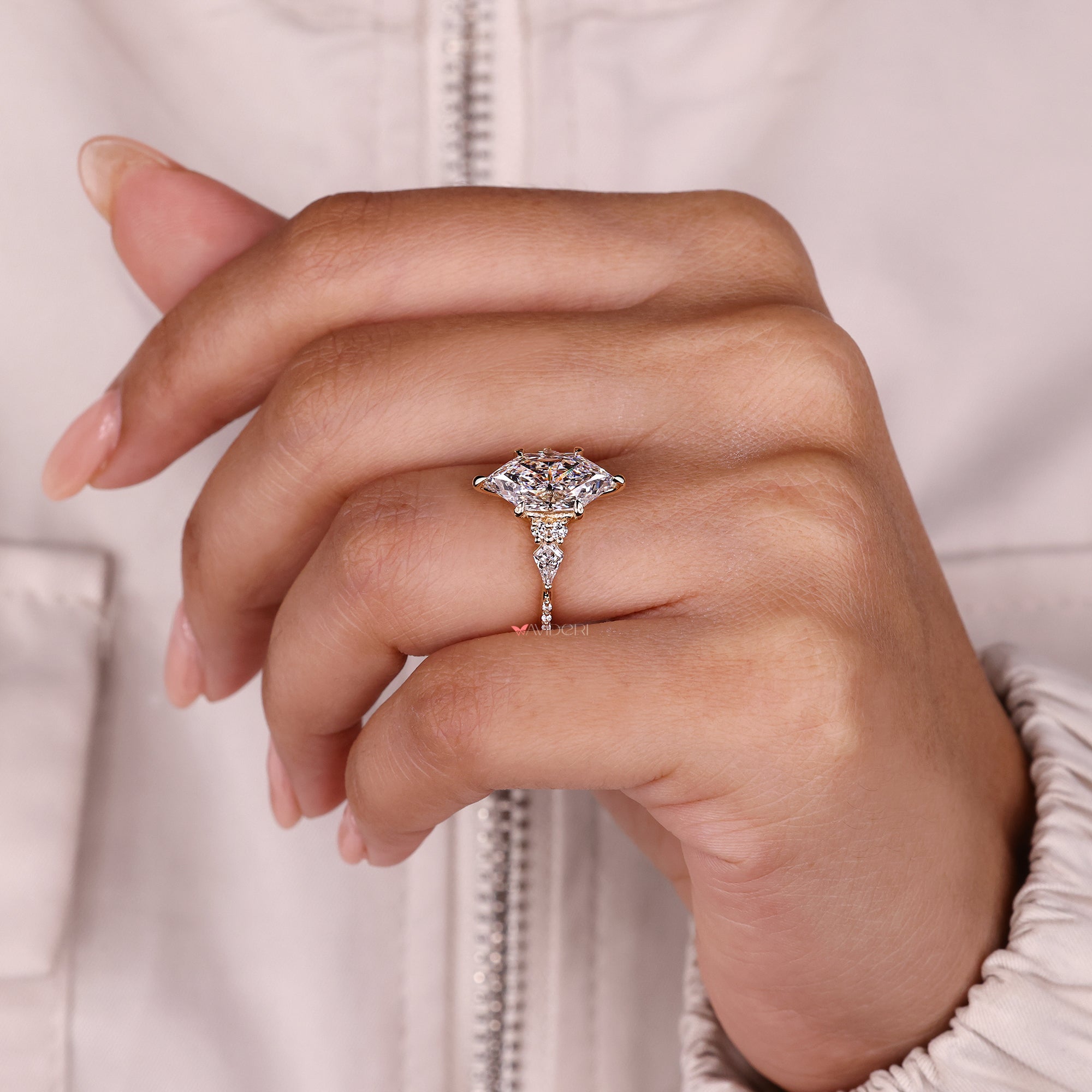 Halo marquise moissanite engagement ring with v prongs.
