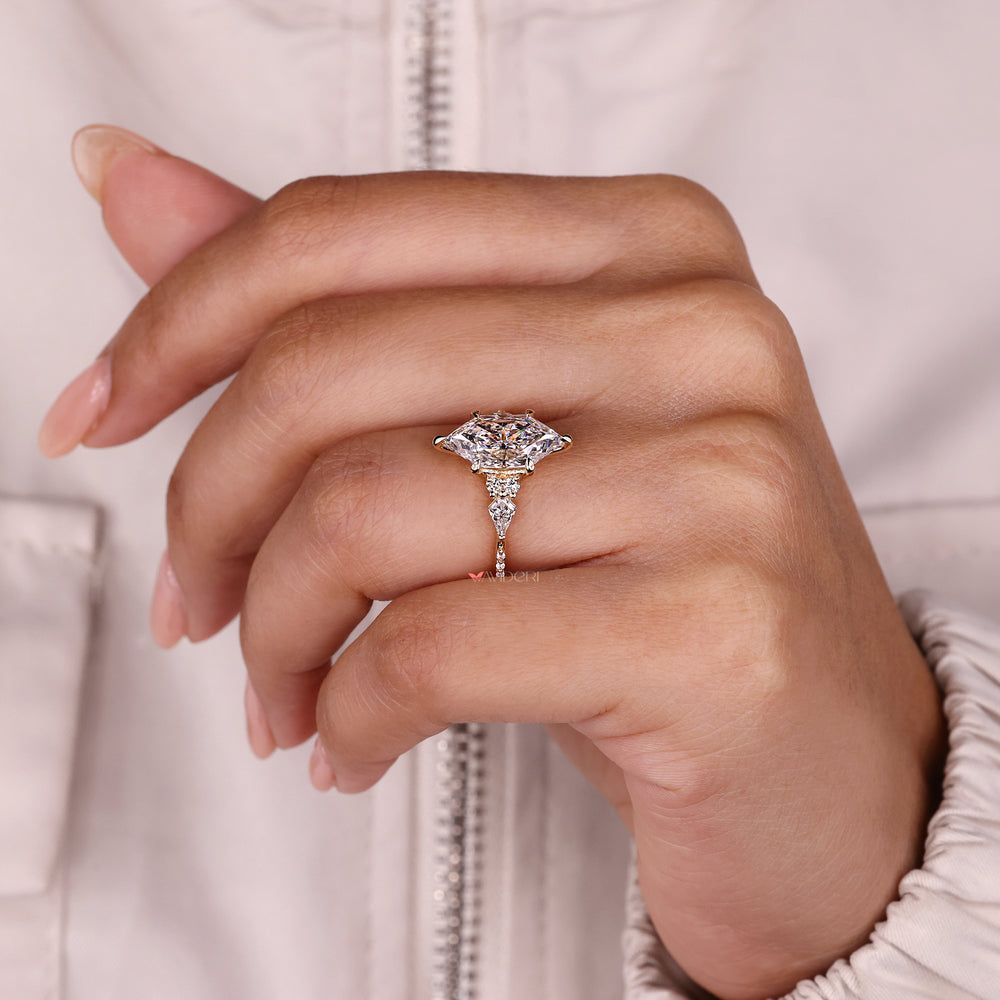 Halo marquise moissanite engagement ring with v prongs.
