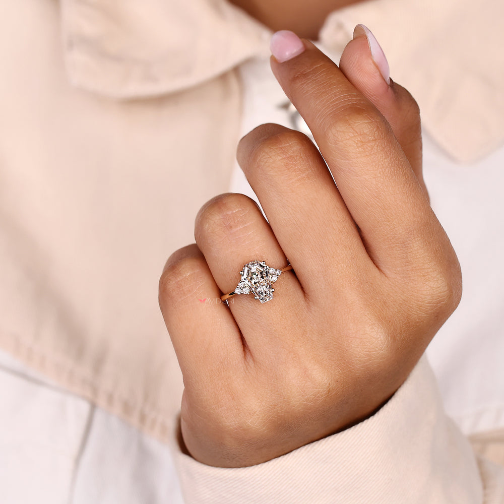 Muse setting seven stone ring with coffin cut diamond.
