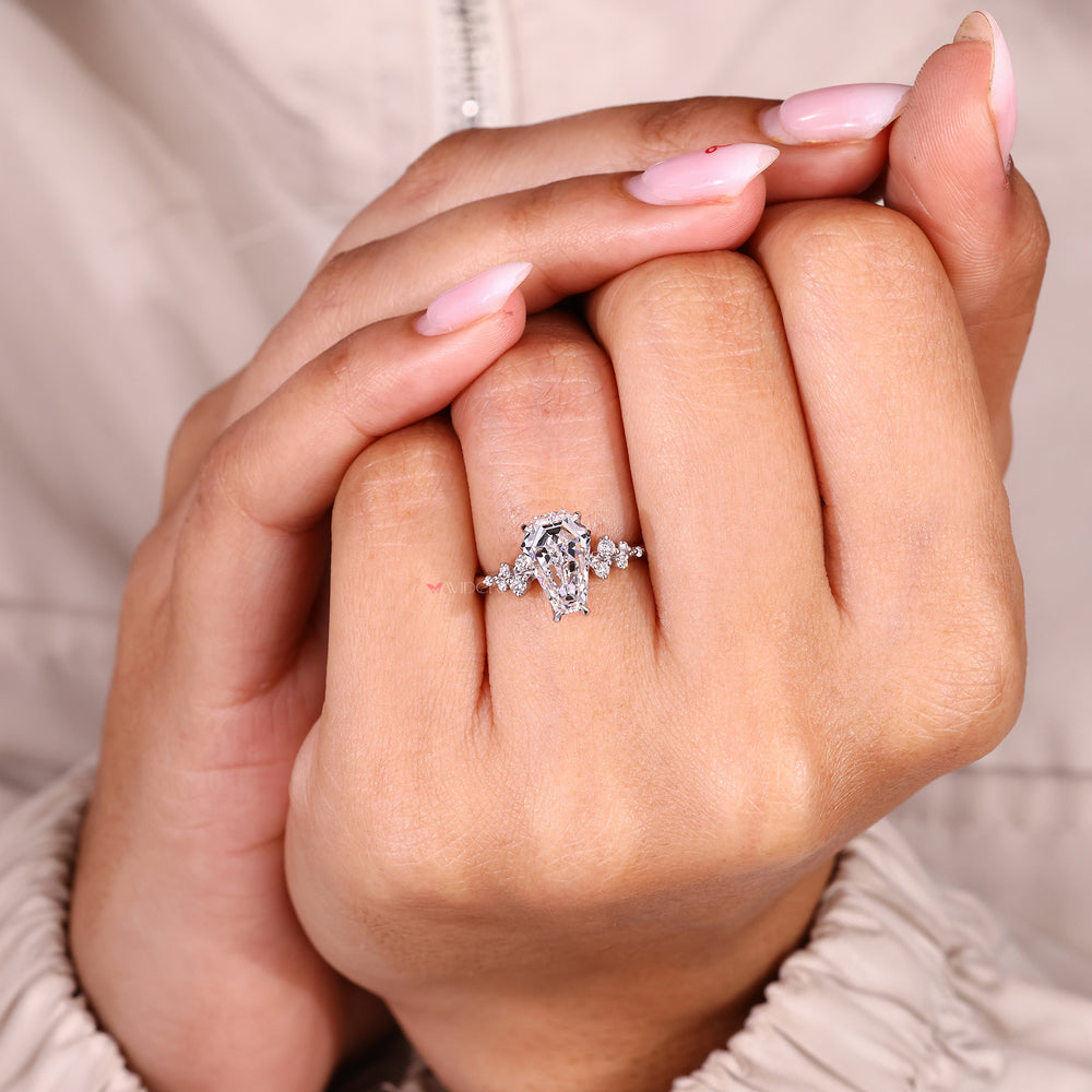 Coffin cut ring with round hidden stone setting.