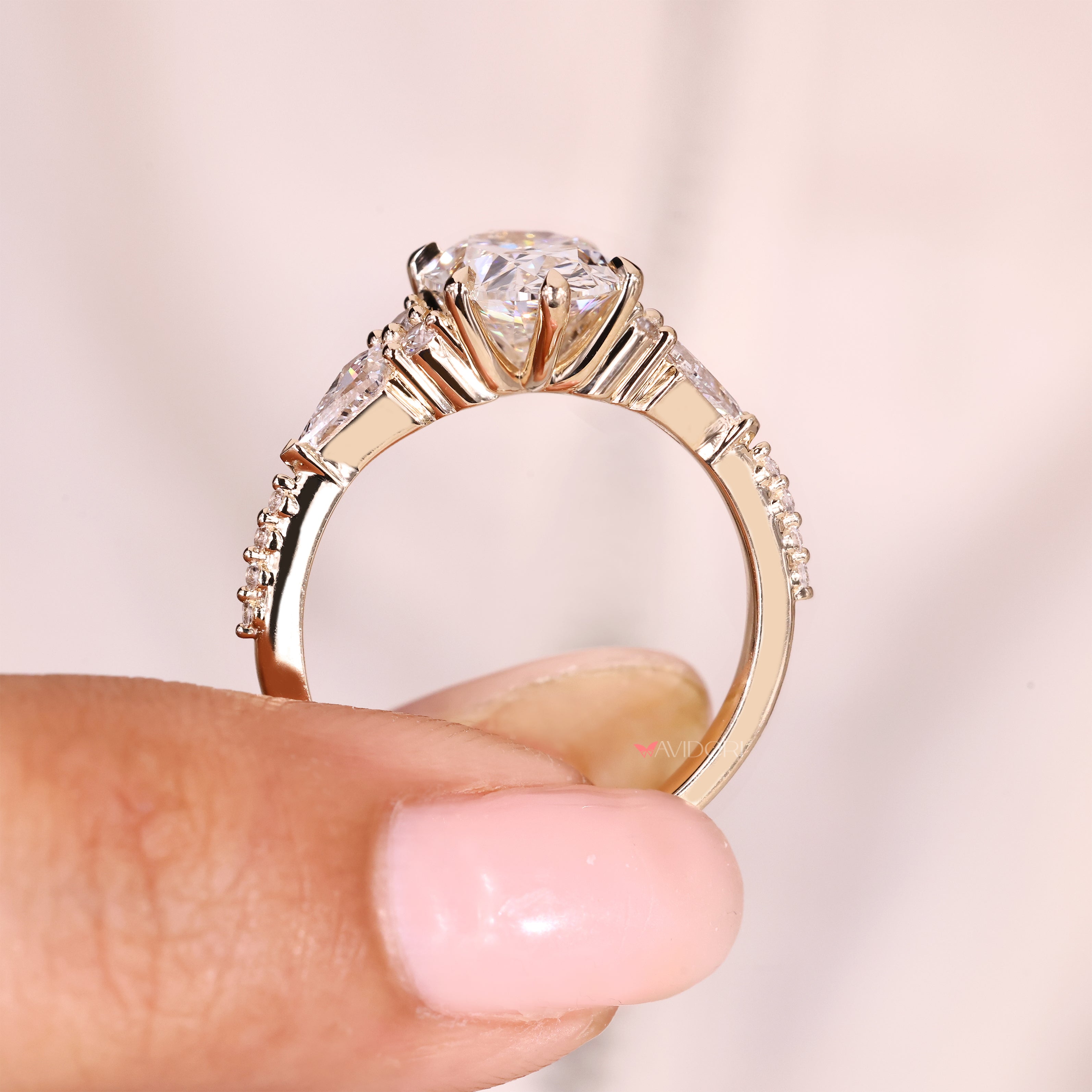 Oval diamond ring with pave style and claw prongs
