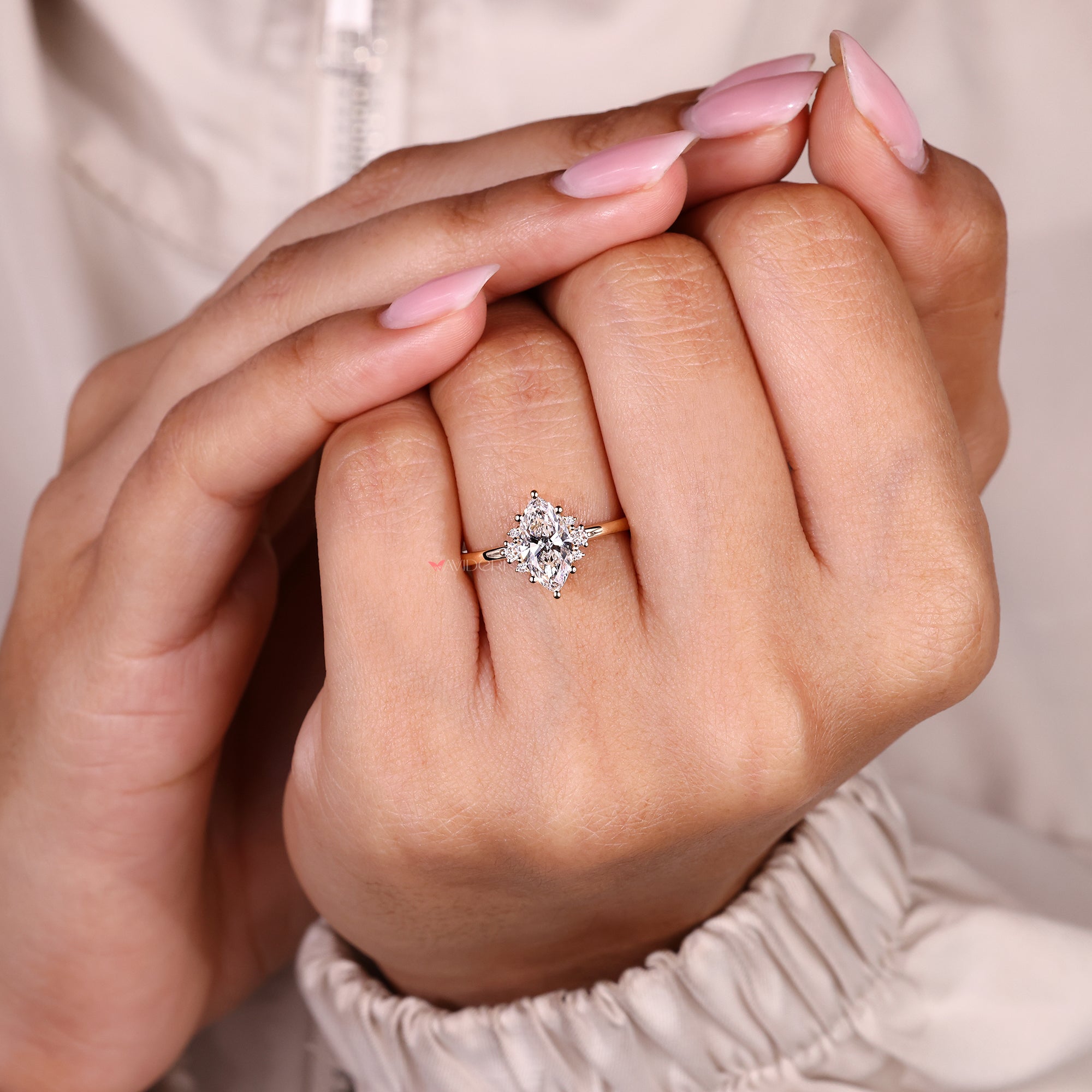 Handmade marquise diamond ring with seven stone layout.
