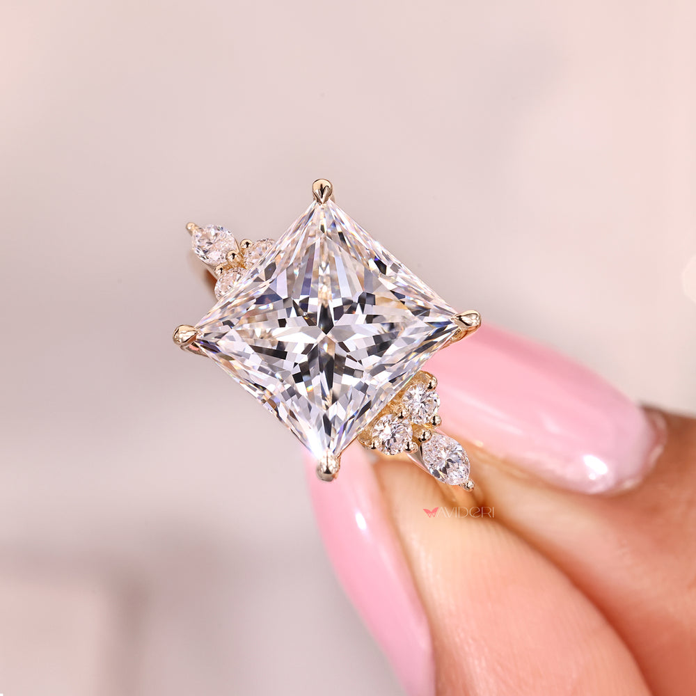 Handmade princess cut diamond ring with four claw prongs.