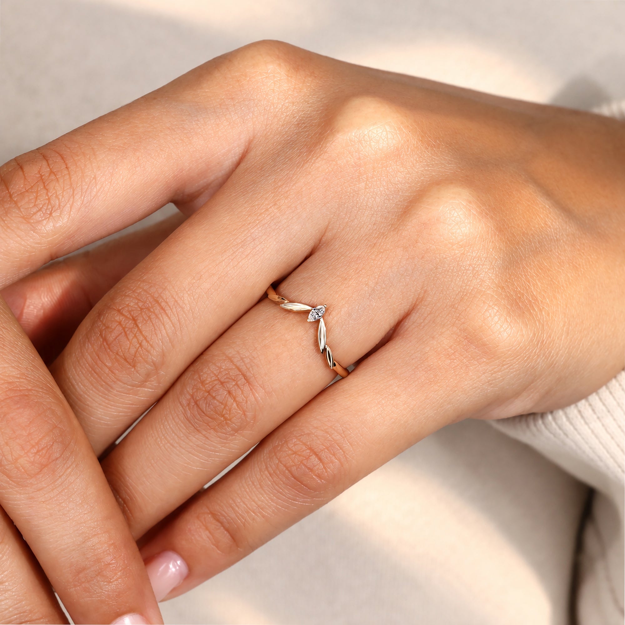 V shaped wedding band with marquise cut diamonds.
