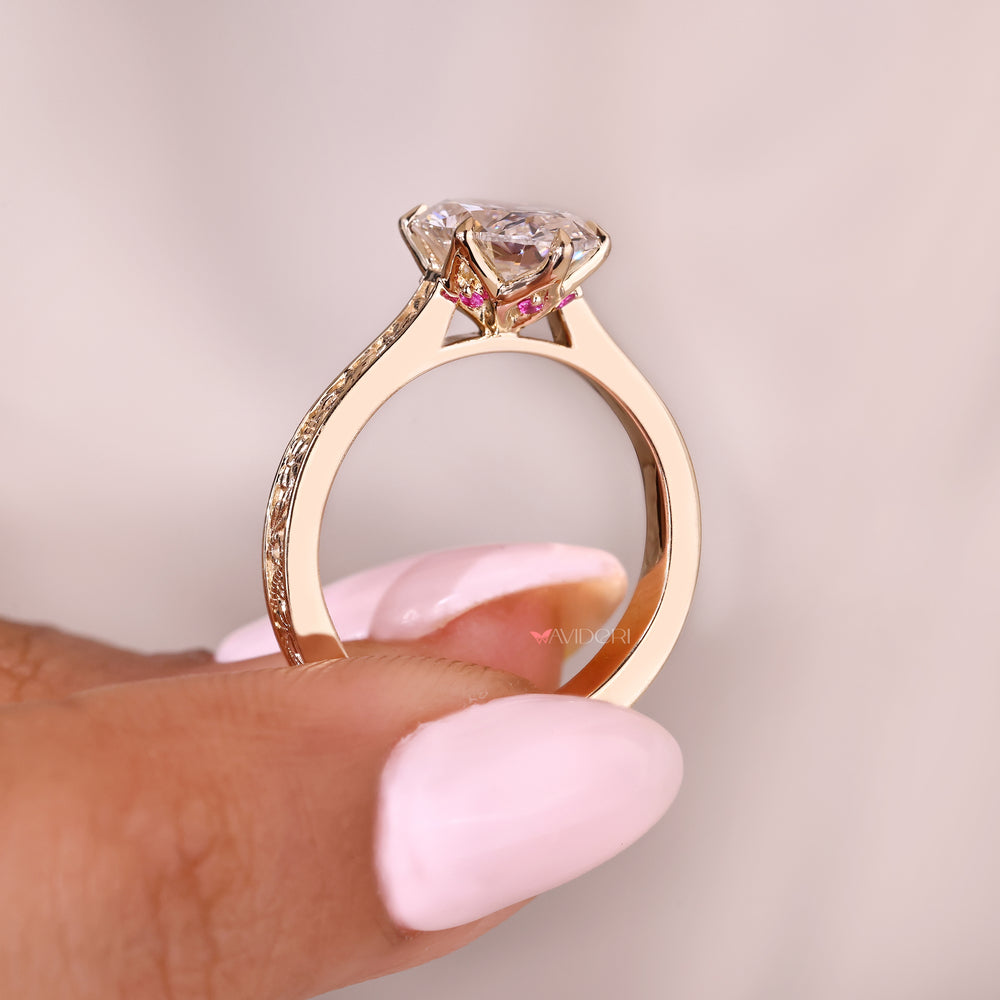 Handmade oval diamond ring with ruby and cathedral setting

