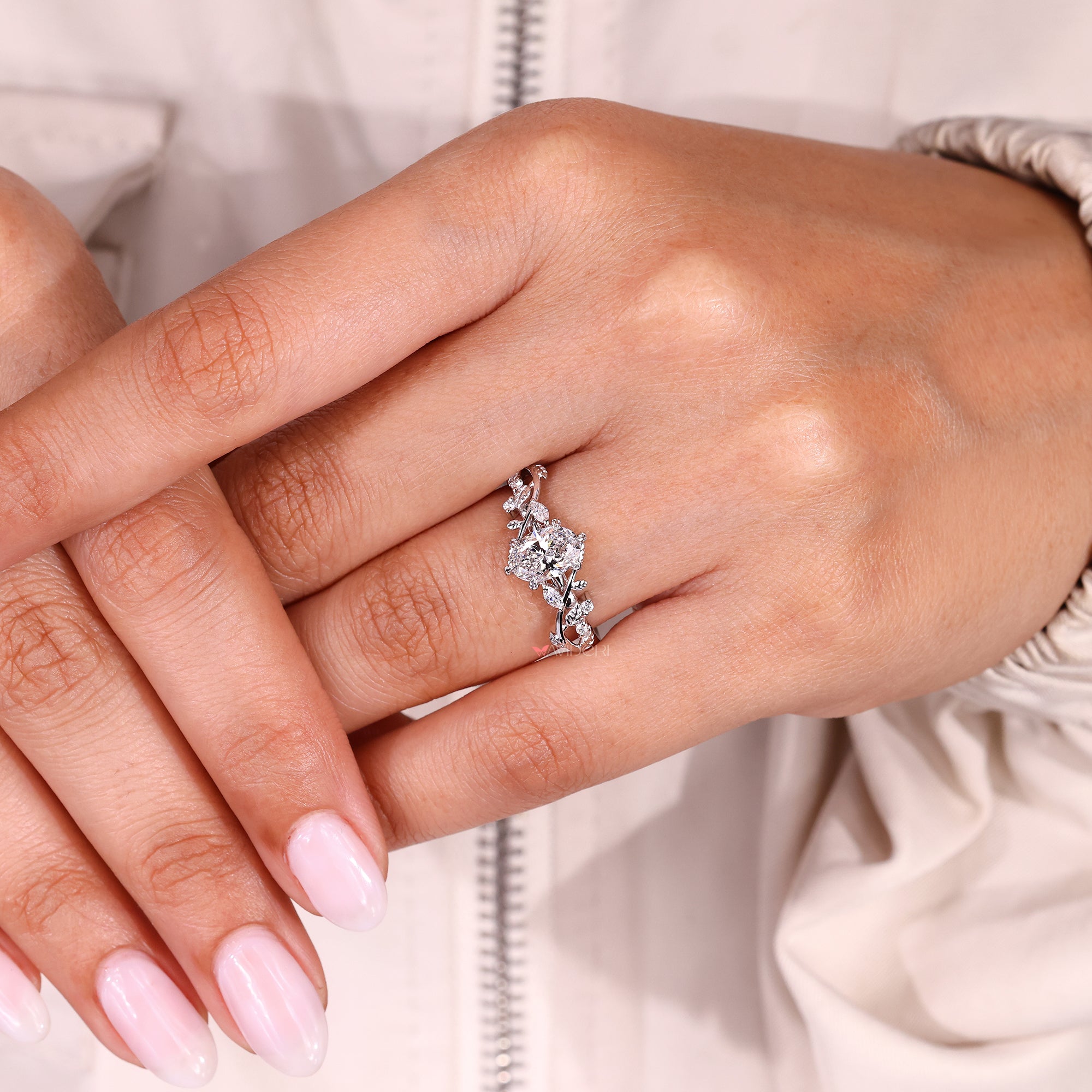 IGI certified oval diamond ring with engraved filigree setting.
