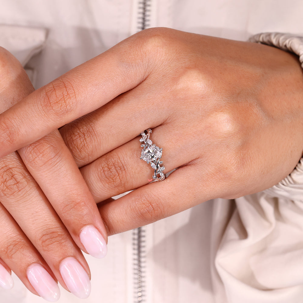IGI certified oval diamond ring with engraved filigree setting.
